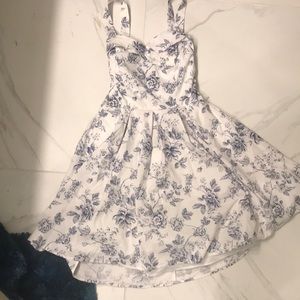 White dress with a navy blue flower pattern